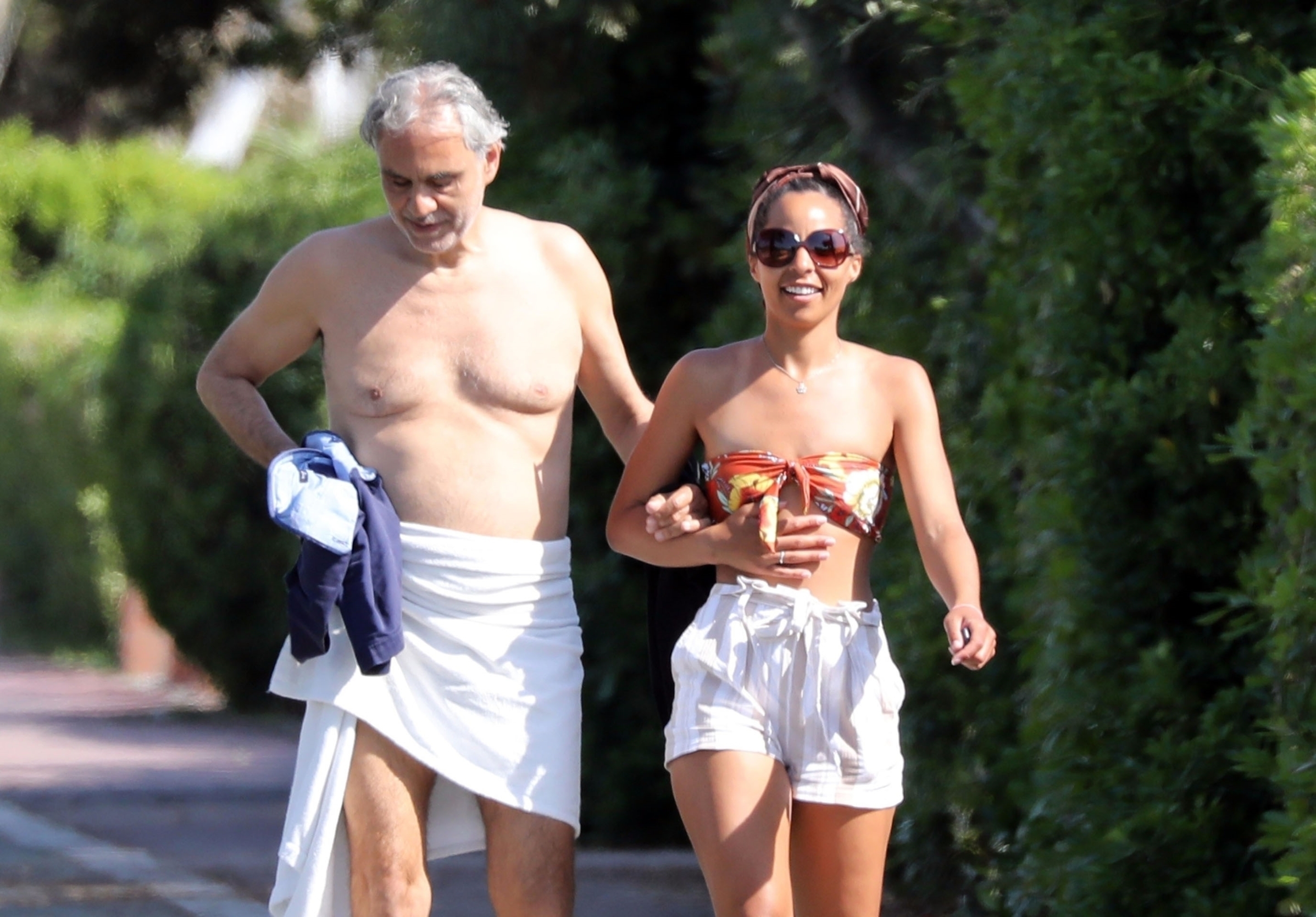 Forte dei Marmi, Lucca, ITALY  - *EXCLUSIVE*  - MUST CALL FOR PRICING BEFORE USAGE  - Italian singer and Opera star Andrea Bocelli looks in good health after revealing recently that he contracted Coronavirus and made a full recovery by the end of March!

The singer was seen on the streets of Forte Dei Marmi dressed only with a towel in the company of a South American friend.

*UK Clients - Pictures Containing Children
Please Pixelate Face Prior To Publication*, Image: 522882914, License: Rights-managed, Restrictions: RIGHTS: WORLDWIDE EXCEPT IN GERMANY, ITALY, Model Release: no, Credit line: BACKGRID / Backgrid UK / Profimedia